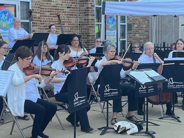 Gallery 1 - A picture of Simply Strings performing outdoors at Rackham Park. 