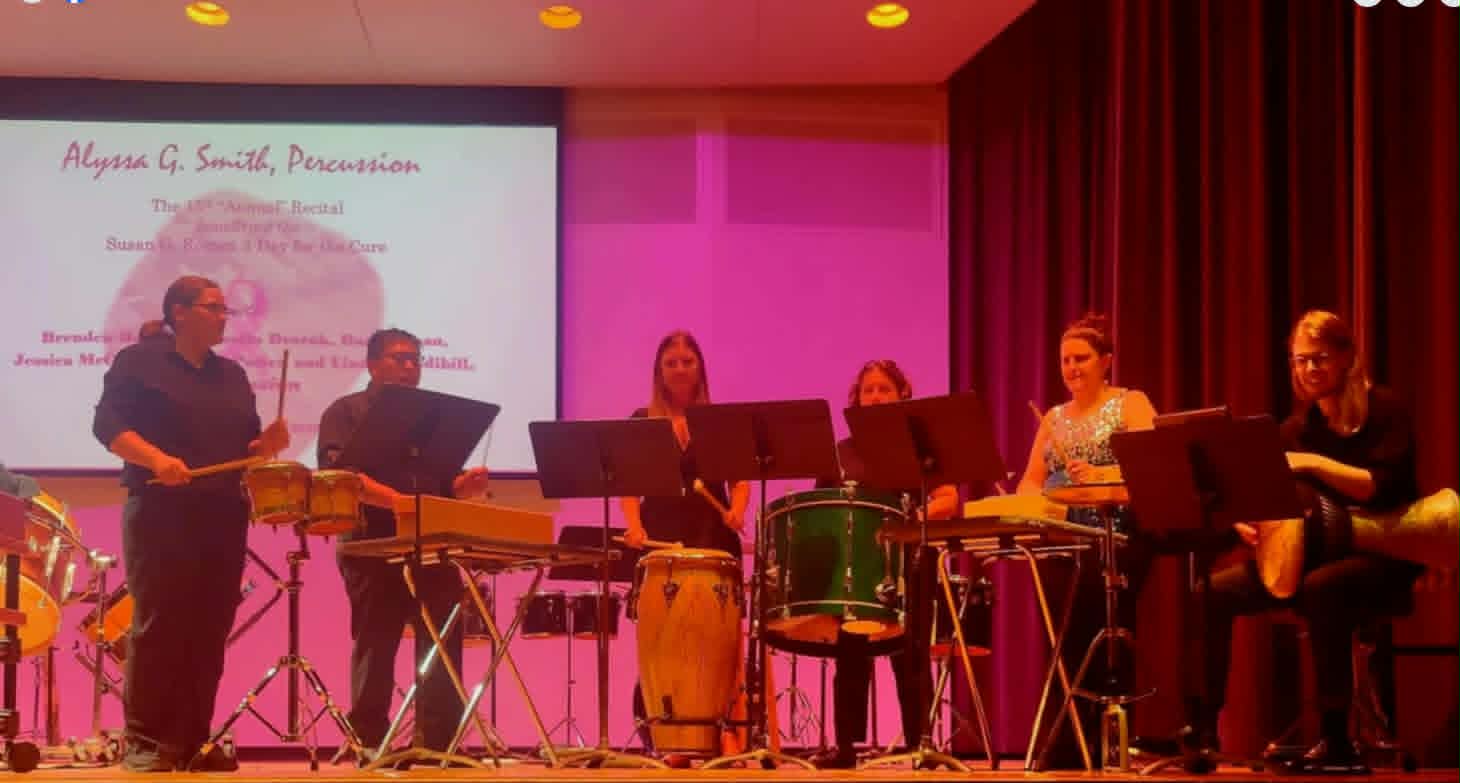 Gallery 1 - A group of musicians playing drums